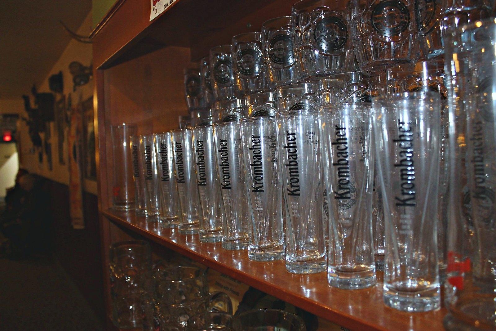 Steins lined up along the bar