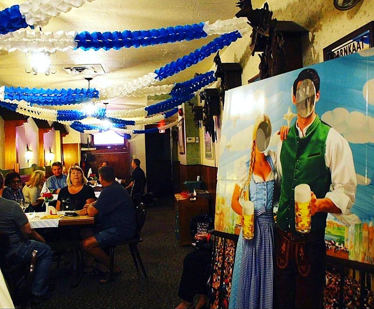Guests dining beneath the Bavarian mural